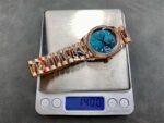 8+ Factory Counterweight Rolex Day-Date 128345RBR-0083 36mm Diamond Bezel Full Rose Gold Baguette Diamond Blue Green Dial - Image 9