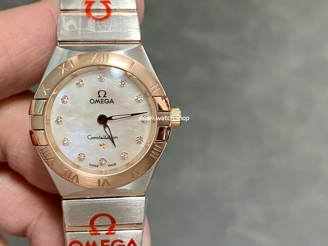TW-Factory-Omega-Constellation-Quartz-123.20.27.60.55.001-27mm-Roma-6.jpg TW Factory Omega Constellation Quartz 123.20.27.60.55.001 27mm Roman Number Rose Gold Bezel Half Rose Gold/Steel, Diamond&Mother Of Pearl Dial - Image 1