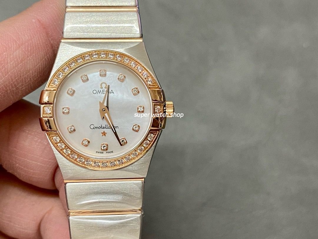 TW-Factory-Omega-Constellation-Quartz-123.25.27.60.55.007-27mm-DiamondRo-4.jpg TW Factory Omega Constellation Quartz 123.25.27.60.55.007 27mm Diamond Rose Gold Bezel Half Rose Gold Steel Mother Of Pearl Diamond Dial - Image 1